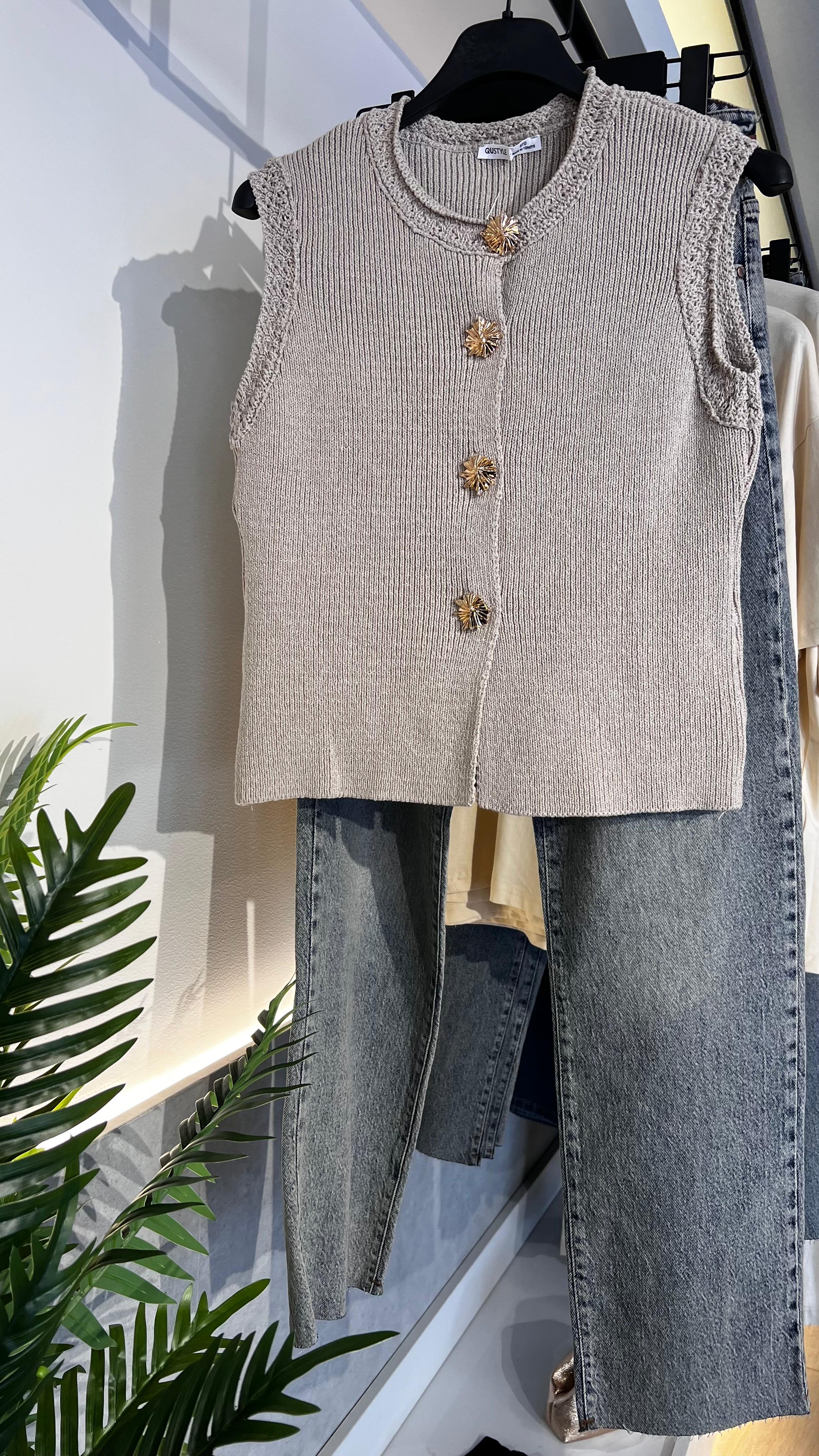 Beige vest with gold buttons